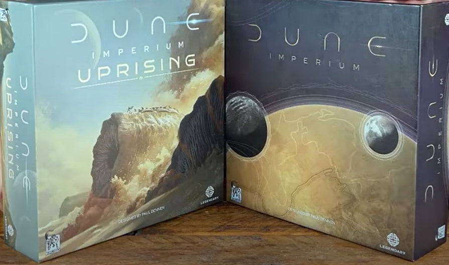 Dune imperium and Dune Imperium Uprising box standing next to each other