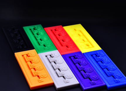 Eight colored Gearboxes for Heat Formula 1 racing board game - lowered angle overview