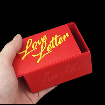 Red Travel box for love letter - half opened and hold in hand