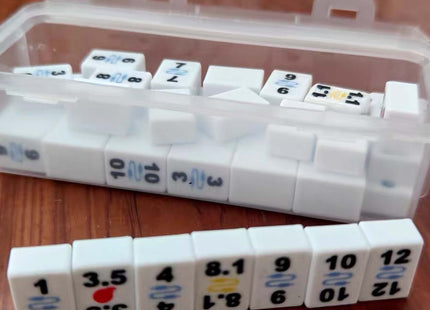 Set of white dice with numbers and symbols on a wooden surface