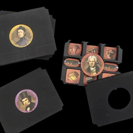 Black Brass token organizers - red player opened and yellow & purple lead closed